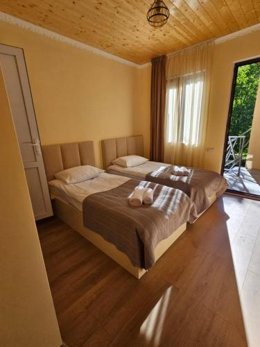 Postel nebo postele na pokoji v ubytování Guest House Gulba