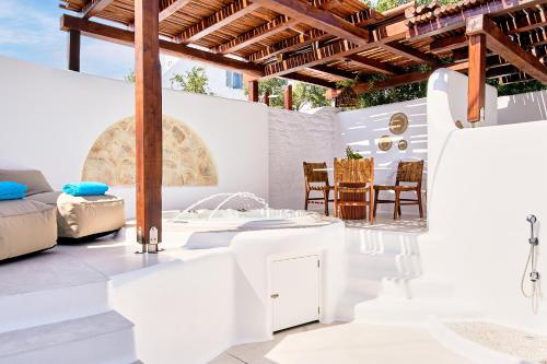 a white bathroom with a sink and a table at Dream on Plaka in Plaka