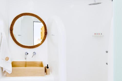 a bathroom with a wooden sink and a mirror at Dream on Plaka in Plaka