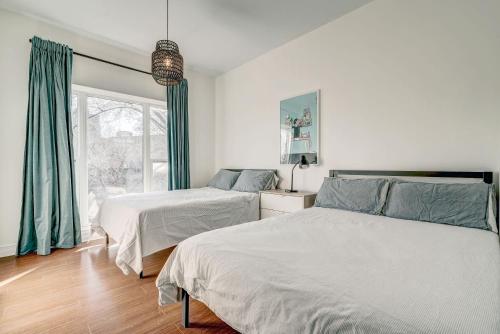 a bedroom with two beds and a window at Private & Exclusive Stay Near Montreal's Nightlife in Montréal
