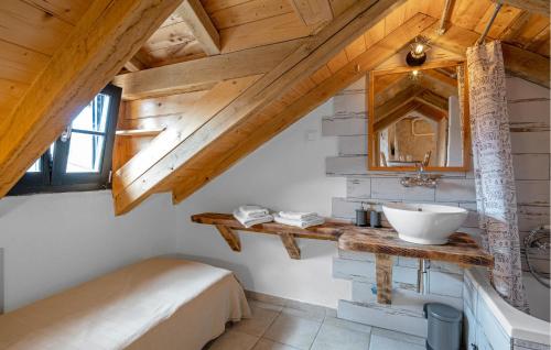a bathroom with a sink and a mirror at 2 Bedroom Amazing Home In Pirovac in Pirovac
