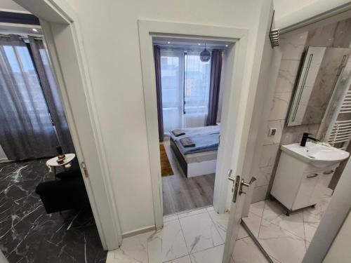 a bathroom with a sink and a mirror at luxury Apartament TD one bedroom in Sofia
