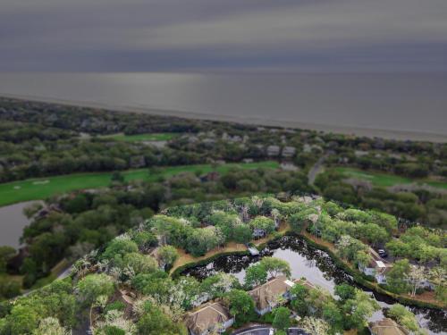 an aerial view of a house with trees and a river at 4821 Turtle Cove Villa by Akers Ellis Rentals in Kiawah Island