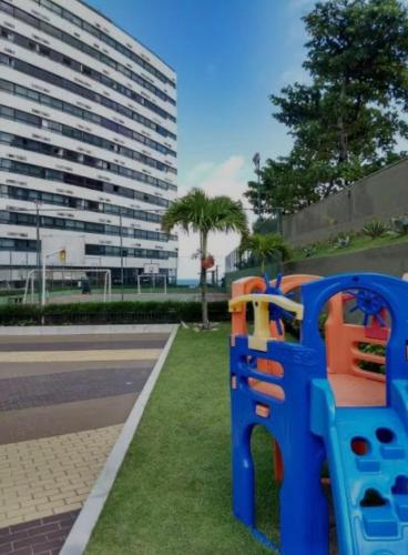a blue toy bench on the side of a street at Ondina Apart Hotel 02 quartos Vista Mar in Salvador