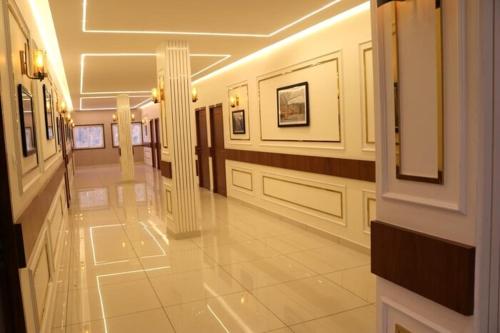 a hallway of a building with a hallwayngth at Ayman Residency in Sarkhej