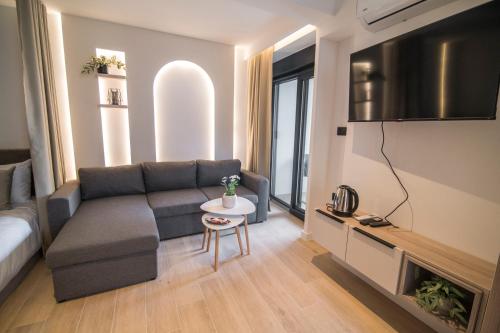 a living room with a couch and a table at Vila Luca in Mostar