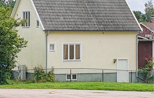 a house with a fence in front of it at Pet Friendly Home In Ruda With Sauna in Ruda