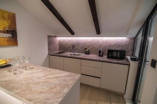 a kitchen with a sink and a counter top at Vila Luca in Mostar