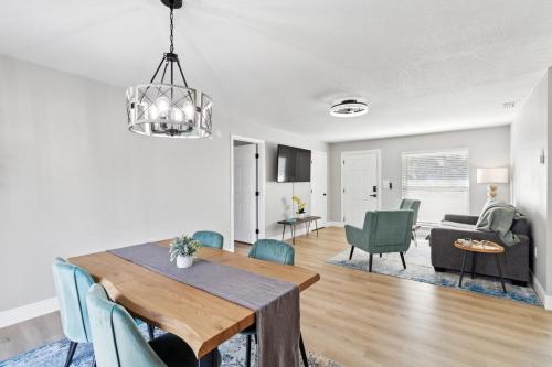 a dining room and living room with a table and chairs at Luxury getaway, relax, and recharge! in Spring Hill