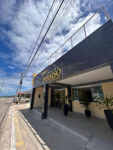 a building with a sign on the side of it at Hotel Paraiso Natal - EXPRESS in Natal