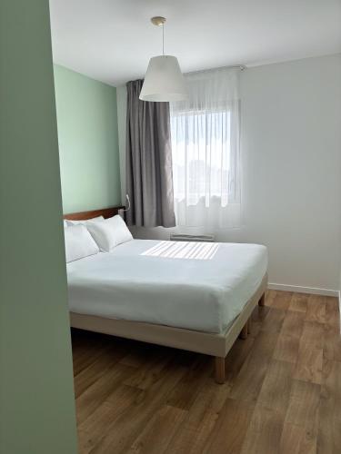 Postel nebo postele na pokoji v ubytování Sure Hotel By Best Western Guerande