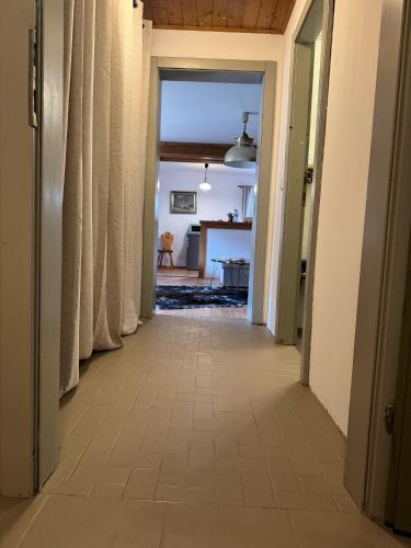 a hallway leading into a living room with a view of a house at AU-4 Ferienwohnung in Lofer