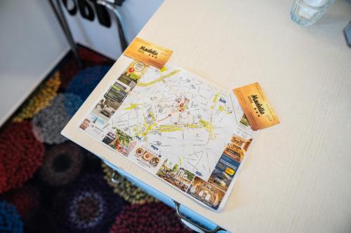 a magazine sitting on top of a table at Hotel Marabella in Sibiu