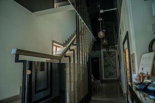 a hallway with a spiral staircase in a house at Hotel Marabella in Sibiu