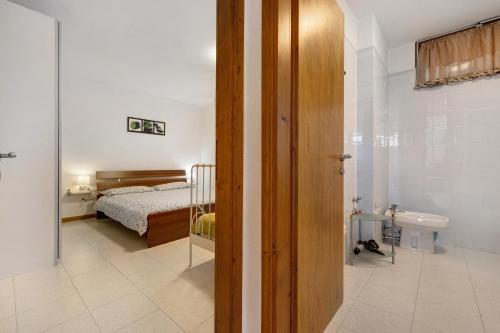 Ένα ή περισσότερα κρεβάτια σε δωμάτιο στο Casa Edda - Sole