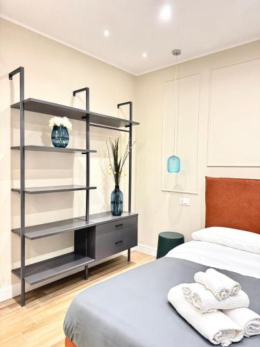 a bedroom with a bed and a shelf at Charm Airport in Reggio di Calabria