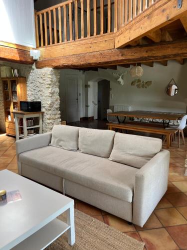 a living room with a couch and a table at Domaine Saladry in Villepinte