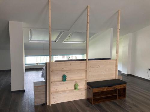 a bed in an empty room with a wooden frame at Le Anfore - Puntone di Scarlino in Dogana