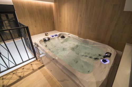 a jacuzzi tub in a room at Vila Luca in Mostar