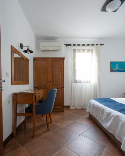 Postel nebo postele na pokoji v ubytování Casa Caria Suites