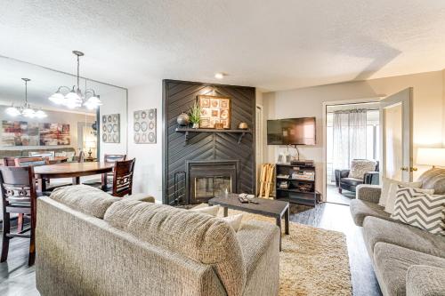 a living room with two couches and a fireplace at 2 Blocks to Angel Fire Resort Family Condo in Angel Fire