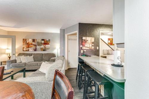 a kitchen and living room with a couch and a table at 2 Blocks to Angel Fire Resort Family Condo in Angel Fire
