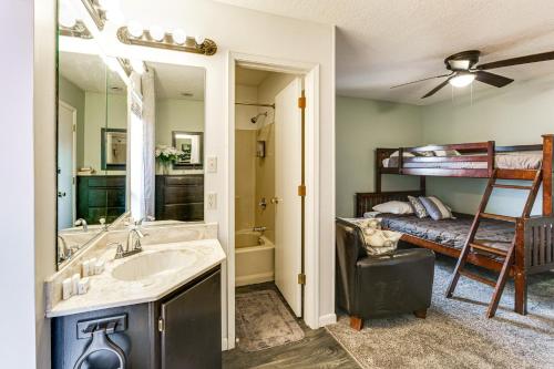 a bathroom with a sink and a bunk bed at 2 Blocks to Angel Fire Resort Family Condo in Angel Fire