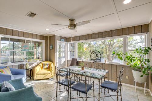 a living room with a table and chairs at Bayfront Haven Group Getaway in Milton! in Milton
