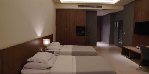 Katil atau katil-katil dalam bilik di Nassim Al Najaf Hotel