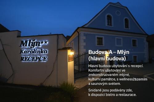 a building with a sign in front of a building at Resort Mlýn Karolínka in Vranov nad Dyjí
