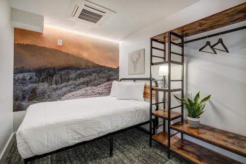 a bedroom with a bunk bed and a painting at The Block Hotel & Commons in Silverthorne
