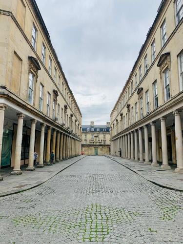 an empty street in the middle of a building at Stylish City Centre Apartment in Bath