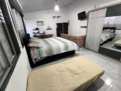 En eller flere senge i et værelse på Sobrado entrada da Cidade