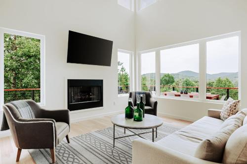 a living room with a couch and chairs and a fireplace at Serenity Now 4br Fall Retreat Deck Fireplace in Young Harris