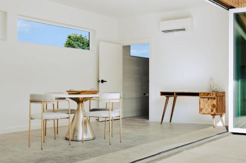 a dining room with a table and chairs at Viking Hut Modern Forest Hideaway Fall Dogs in Young Harris
