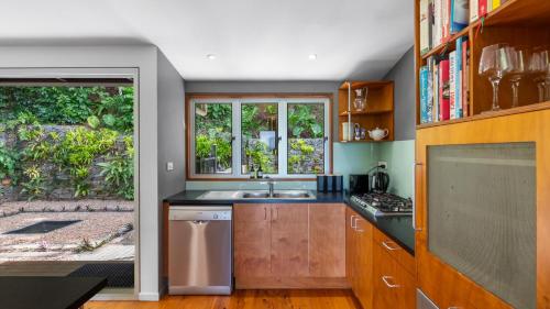 a kitchen with a sink and a window at Mountain Breeze Retreat in Smithfield