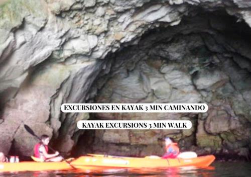 a group of people in kayaks in a cave at Apartalux Sublime Plus in Las Negras