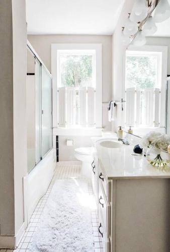 a white bathroom with a sink and a shower at Charming 2Bed 2Bath Bungalow Shandon in Columbia