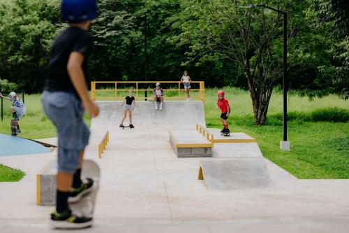 a group of people skateboarding at a skate park at Beautifully Remodeled Condo w - Pool in Playa Conchal