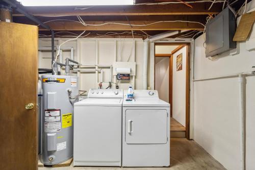 a kitchen with a sink and a refrigerator at PEACEFUL WATERS in Gravois Mills