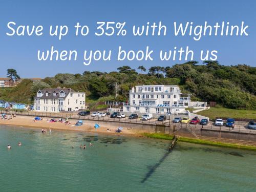 a picture of a beach with the words save up to with worthwhile when at The Penthouse in Totland
