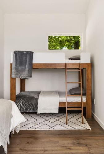a bedroom with a bunk bed with a desk at Paradise View 4br Fall Retreat Firepit Dogs in Young Harris