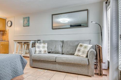 a living room with a couch and a mirror at Beachfront 9 Condo on Old Orchard Beach in Old Orchard Beach