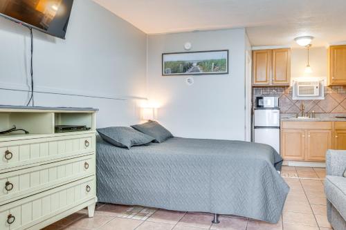a bedroom with a bed and a kitchen at Beachfront 9 Condo on Old Orchard Beach in Old Orchard Beach