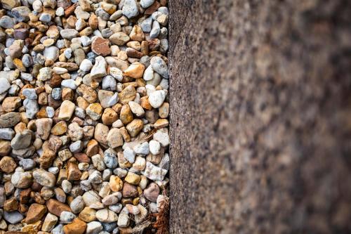 a pile of rocks on the side of a wall at O Camiño Fala Hotel in Mazaricos