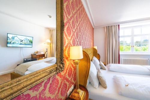Postel nebo postele na pokoji v ubytování Hotel Porto Sofie Gottlieben