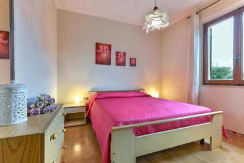 En eller flere senge i et værelse på Casa la Quercia