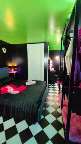 a bedroom with a bunk bed and a checkered floor at Secret Room Anagni in Anagni