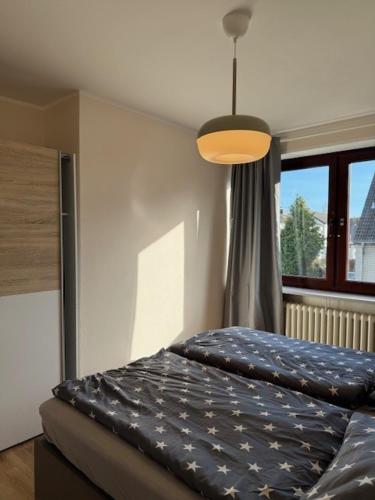 a bed in a room with a large window at Ostseeliebe 5 in Dahme