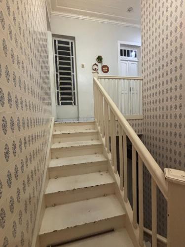 a staircase in a house with a stair case at Hostel e Pousada Sr Borba in Recife